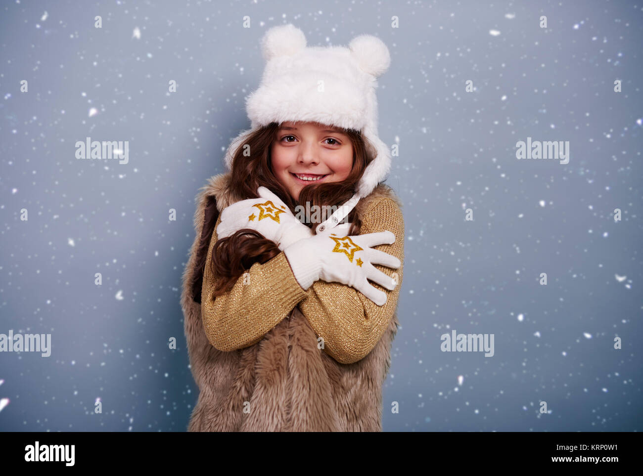 Cute girl shivering with cold Stock Photo - Alamy