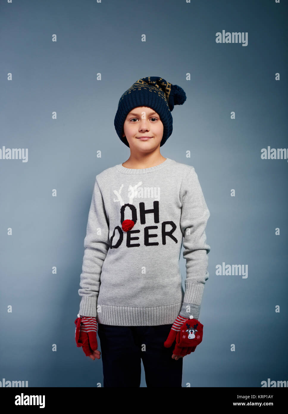 Cheerful boy with glove and knit hat Stock Photo
