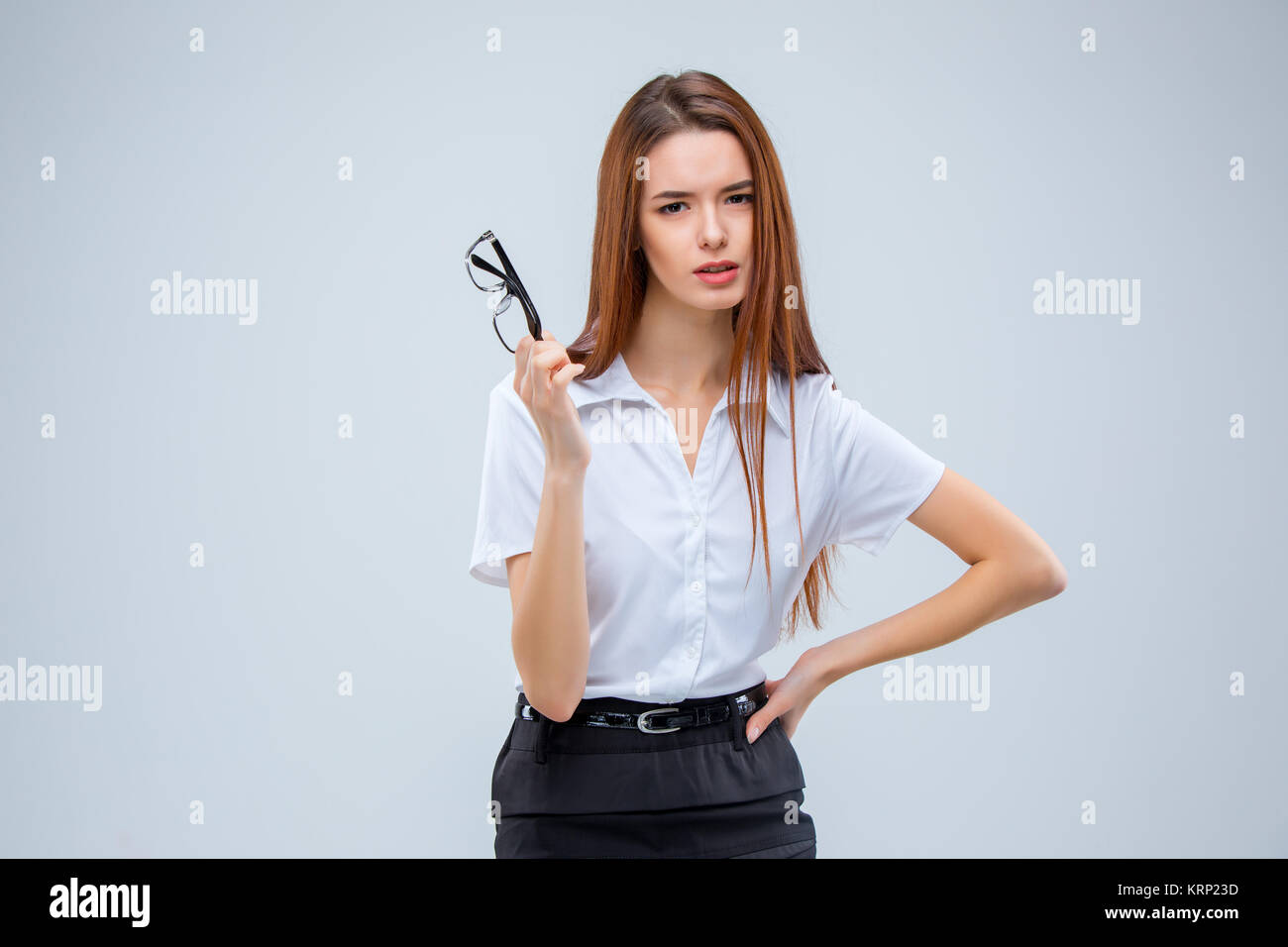 The young business woman on gray background Stock Photo - Alamy