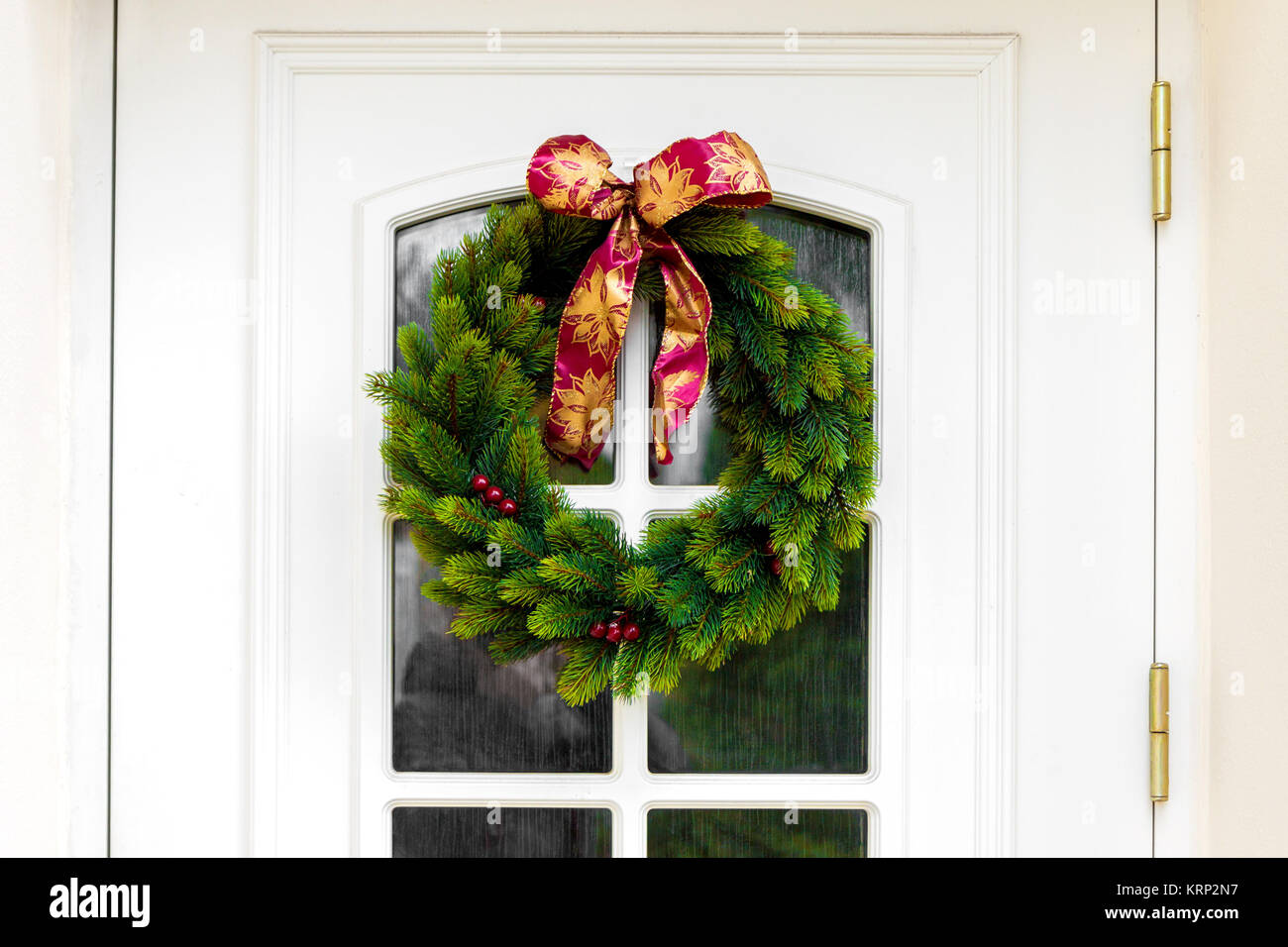 Christmas wreath on a white home doors Stock Photo