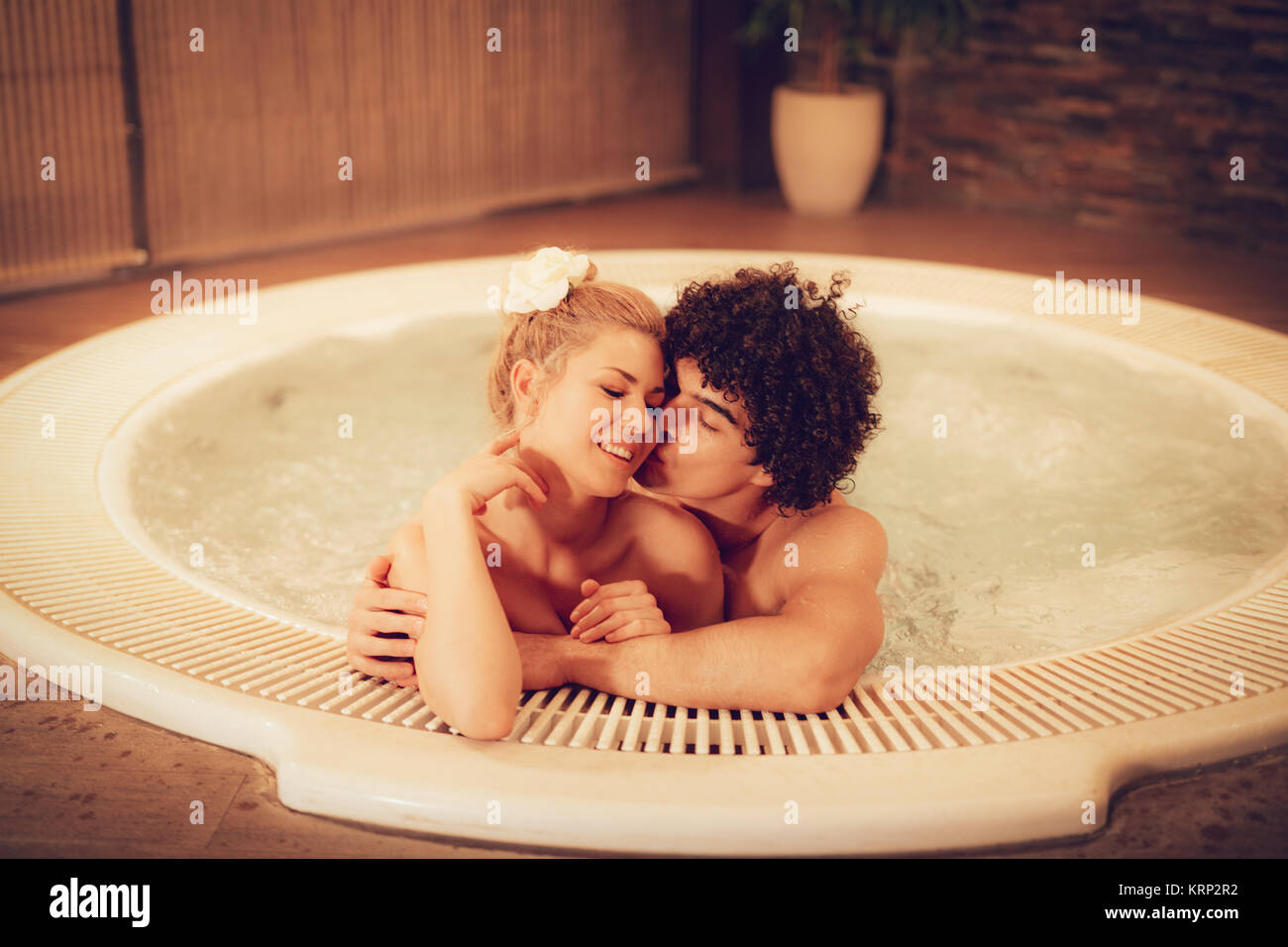 Explicit once phantom Beautiful young couple enjoying in a hot tub at the spa centre Stock Photo  - Alamy