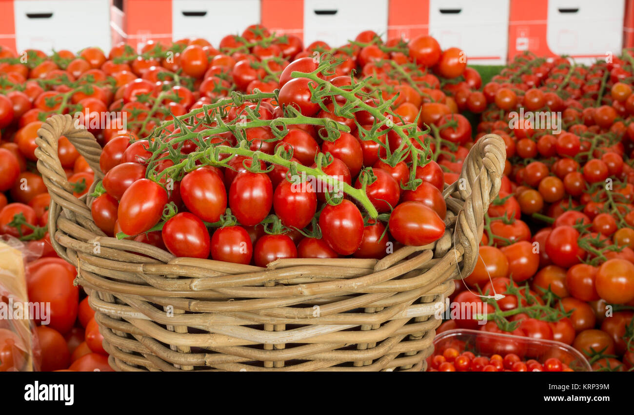 basket with red tomatoes Stock Photo - Alamy