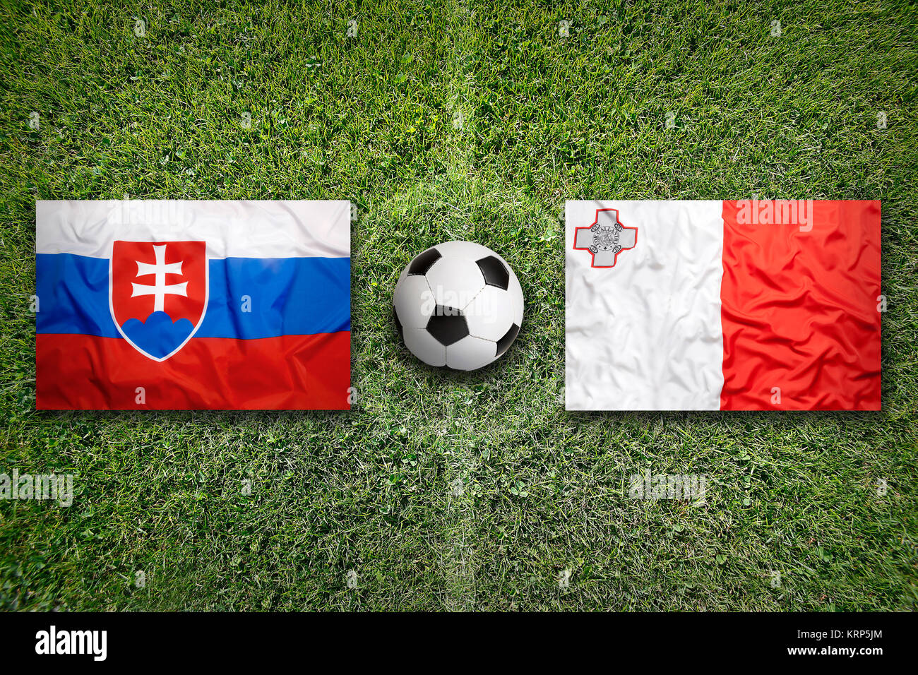 Slovakia vs. Malta flags on soccer field Stock Photo Alamy