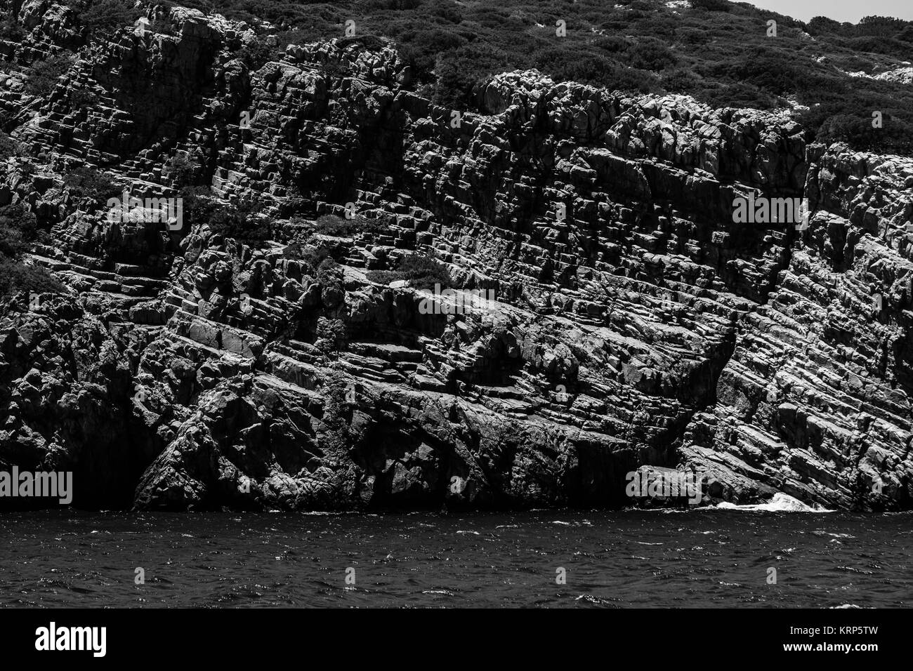 Mediterranean Sea. Crete. Greece. The cliffs of the peninsula of Kalydon. Black and white. Stock Photo