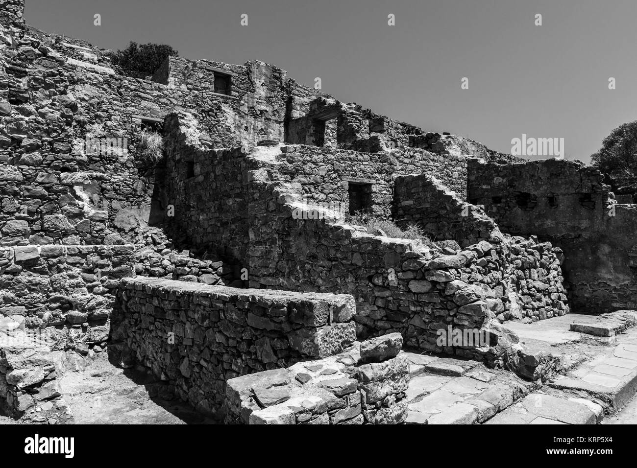 The ruins of the Venetian fortress on Spinalonga island. Crete. Greece. Black and white. Stock Photo