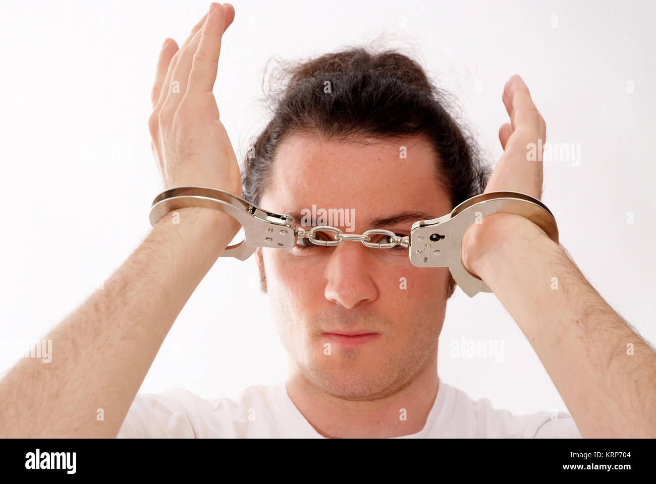 Mann in Handschellen - man in handcuffs Stock Photo
