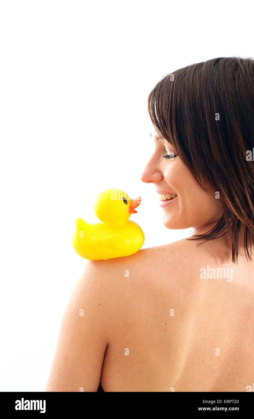 Junge Frau mit Badeente auf der Schulter - young woman with rubber duck on shoulder Stock Photo