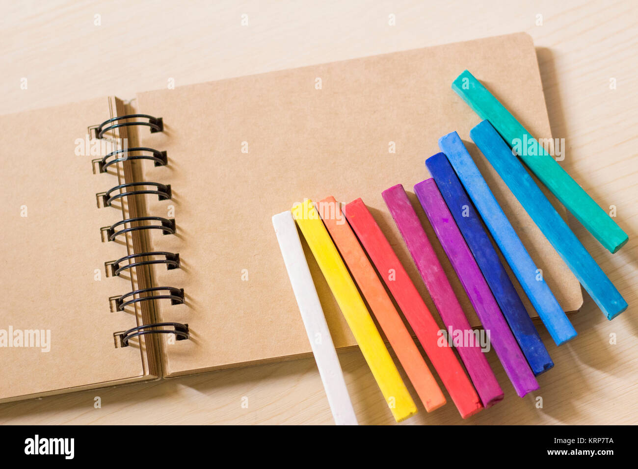 Colorful pastels on a sketch book Stock Photo
