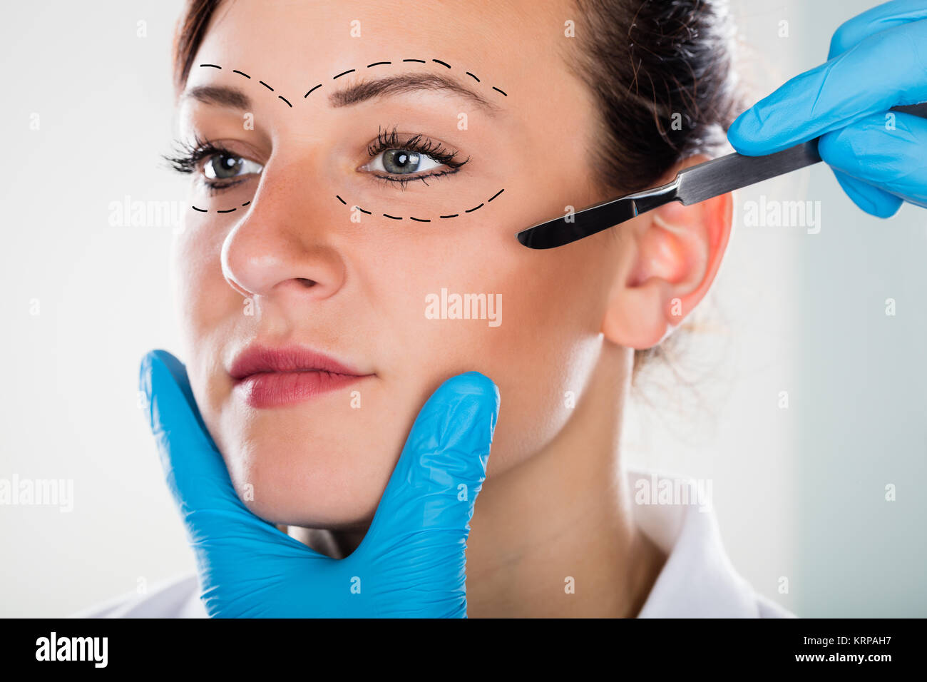 Cosmetic Face Surgery With Scalpel Stock Photo Alamy