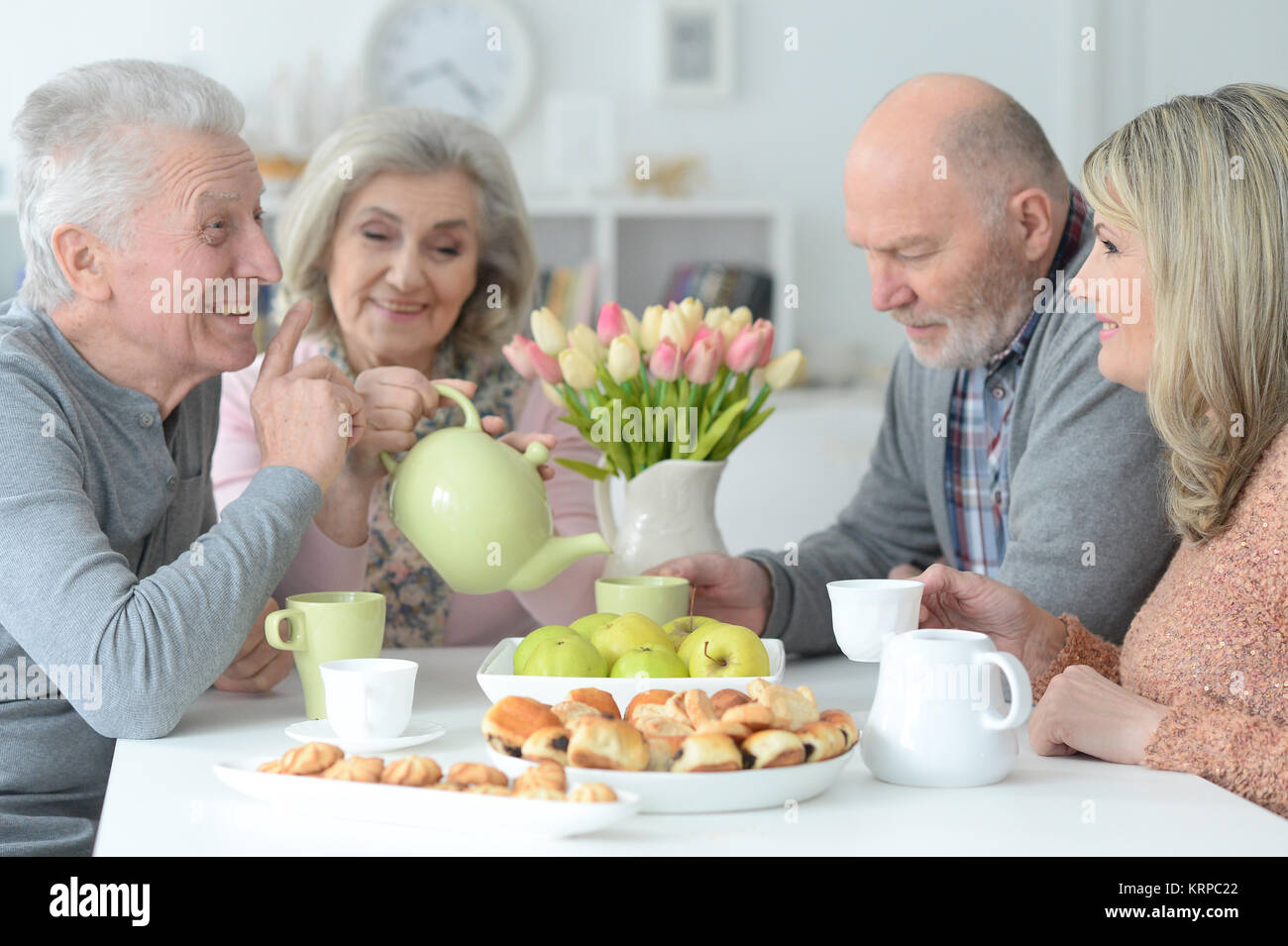 two  Senior couples drinking tea  Stock Photo