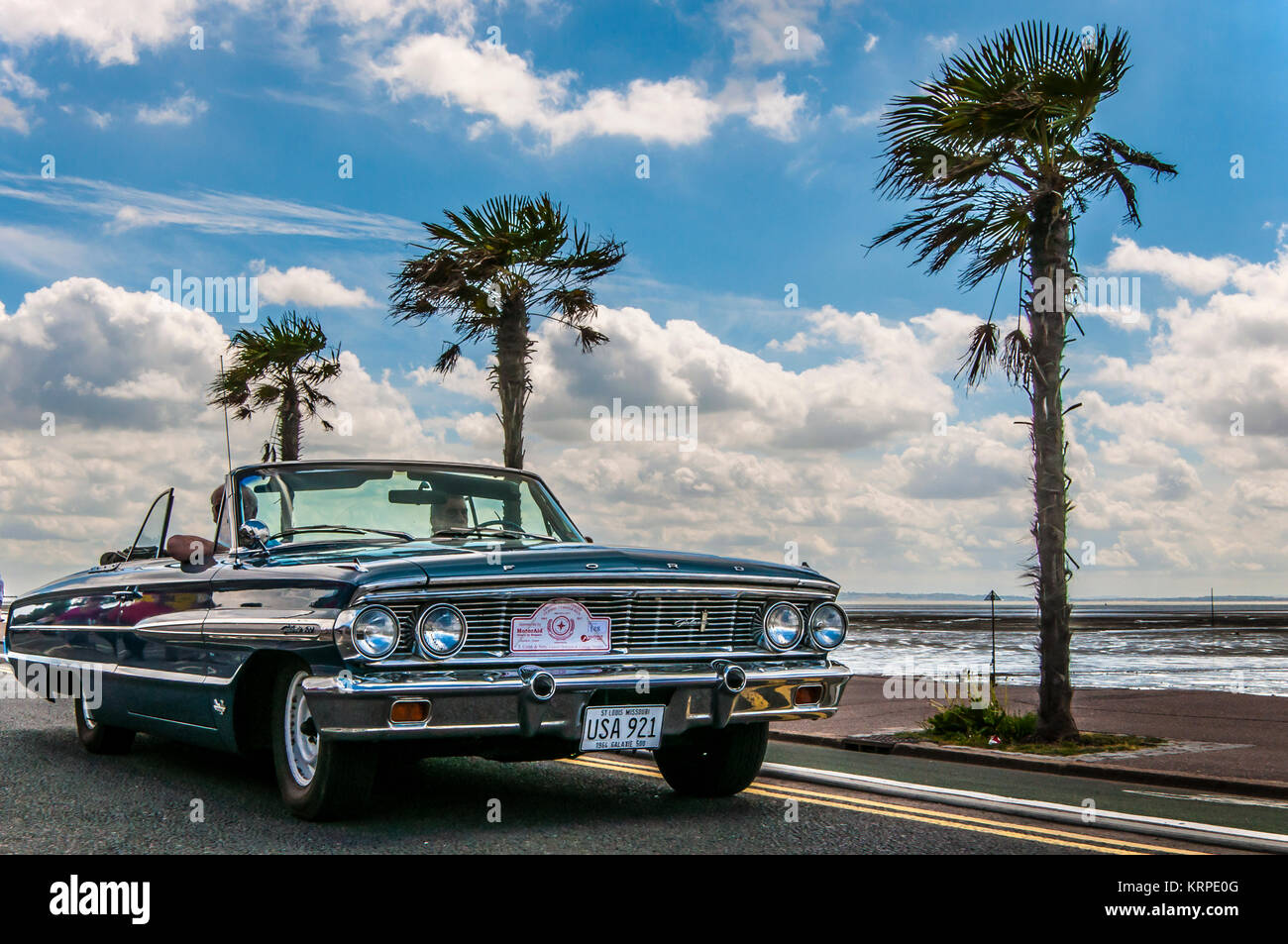 1964 Ford Galaxie 500 classic American car at Southend on Sea seafront with palm trees. USA plate. Vintage look. Seaside. Coast road Stock Photo