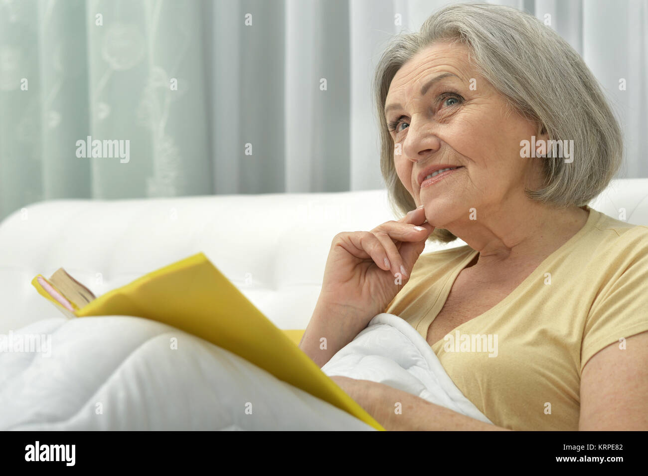 beautiful senior woman with book Stock Photo