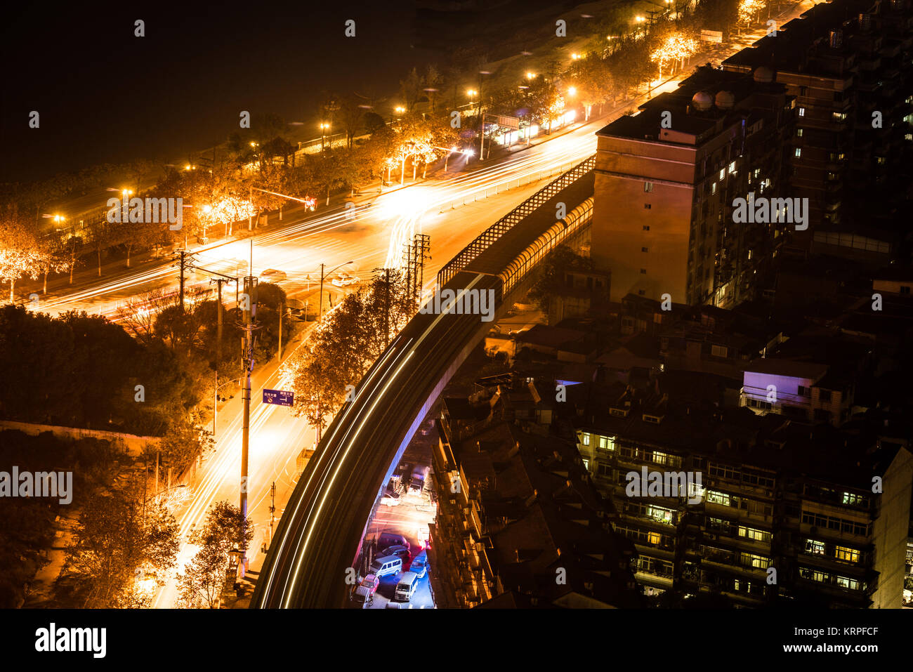 Aerial night view of a road junctions with cars lights trail in Wuhan central China Stock Photo
