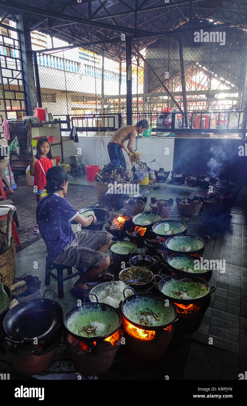 Mekong Delta, Vietnam - Sep 2, 2017. People cooking traditional pancake at local restaurant in Mekong Delta, Vietnam. Stock Photo