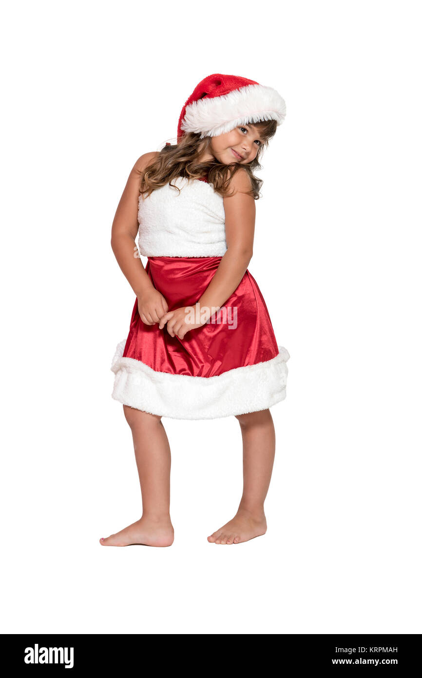 Little girl in Santa Claus costume is posing Stock Photo