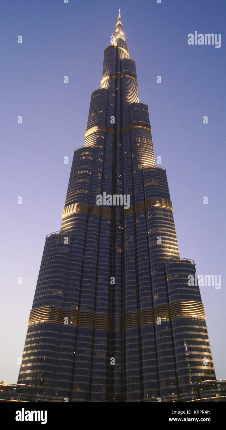 DUBAI, UNITED ARAB EMIRATES - MARCH 31st, 2014: Burj Khalifa, world's tallest tower in Downtown Burj Dubai at night next to the Dubai Mall Stock Photo
