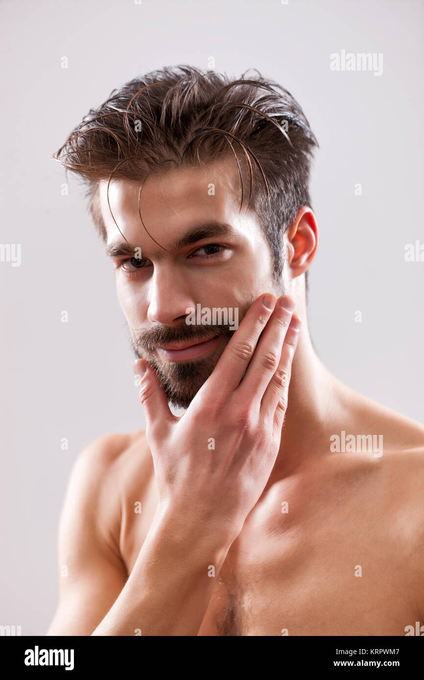 Studio shot portrait of young handsome man Stock Photo - Alamy
