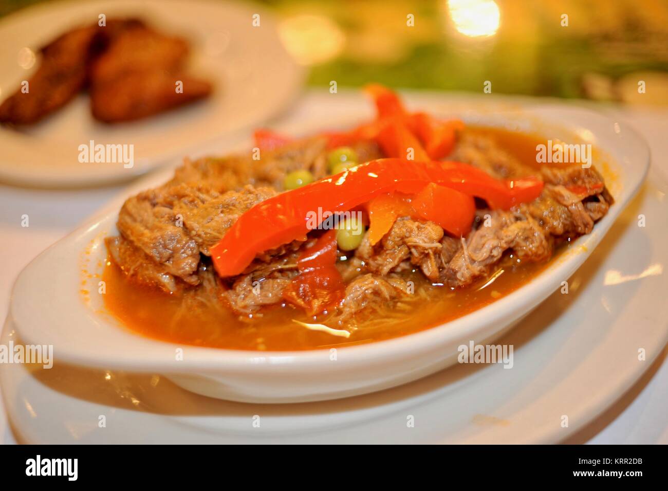 Plated traditional and delicious ropa vieja stew, a Cuban food in restaurant/cafe in Calle Ocho, Little Havana in Miami, Florida, USA. Stock Photo