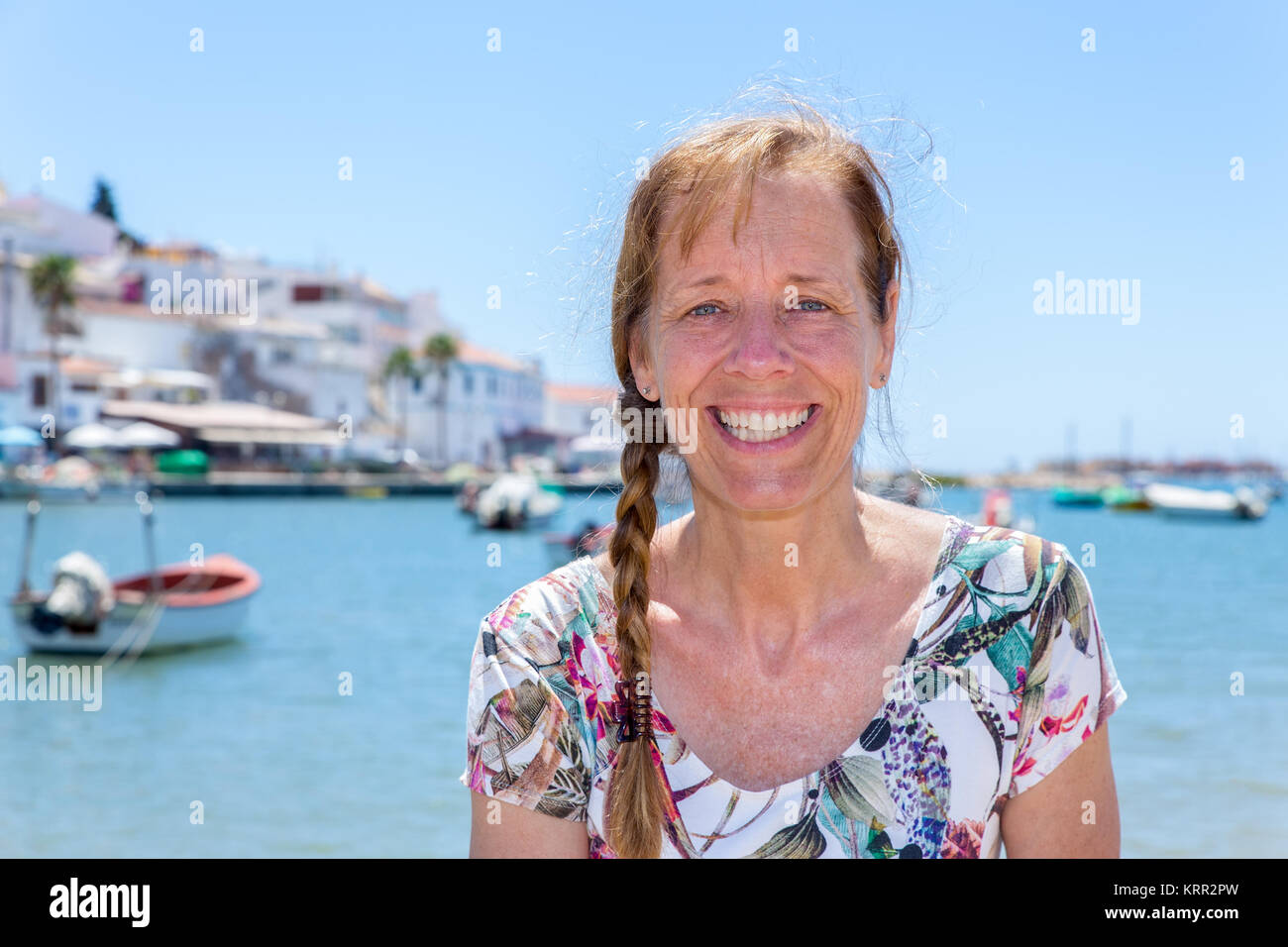 Woman as tourist in harbor of Portugal Stock Photo