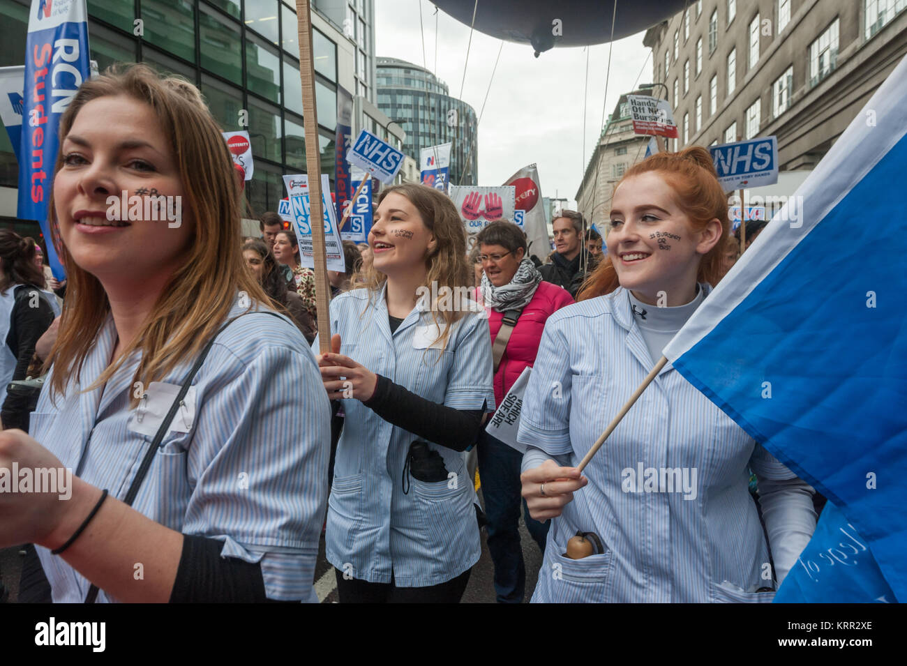 Student nurses with #Bursary or Bust on their cheeks march down YorkRd on the march to save NHS Student Bursaries Stock Photo