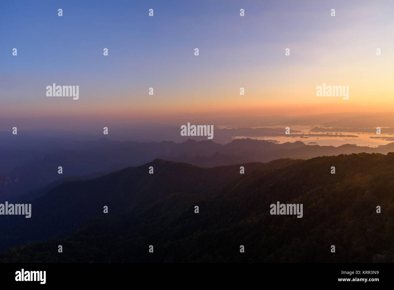 peak view of high mountain in sunset time Stock Photo - Alamy