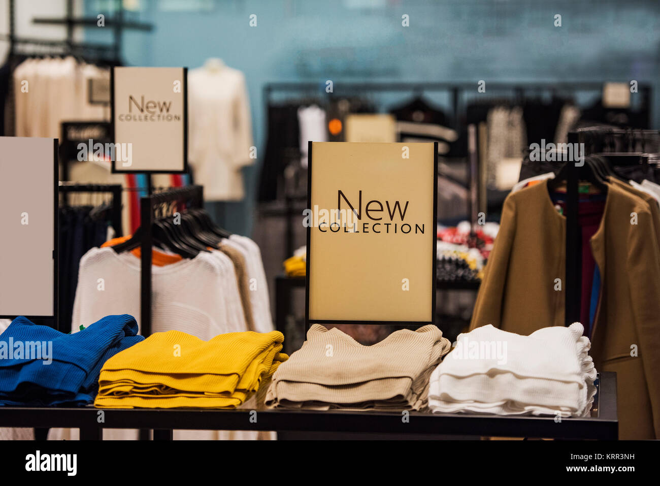 Stacks of clothes in a fashion store Stock Photo - Alamy