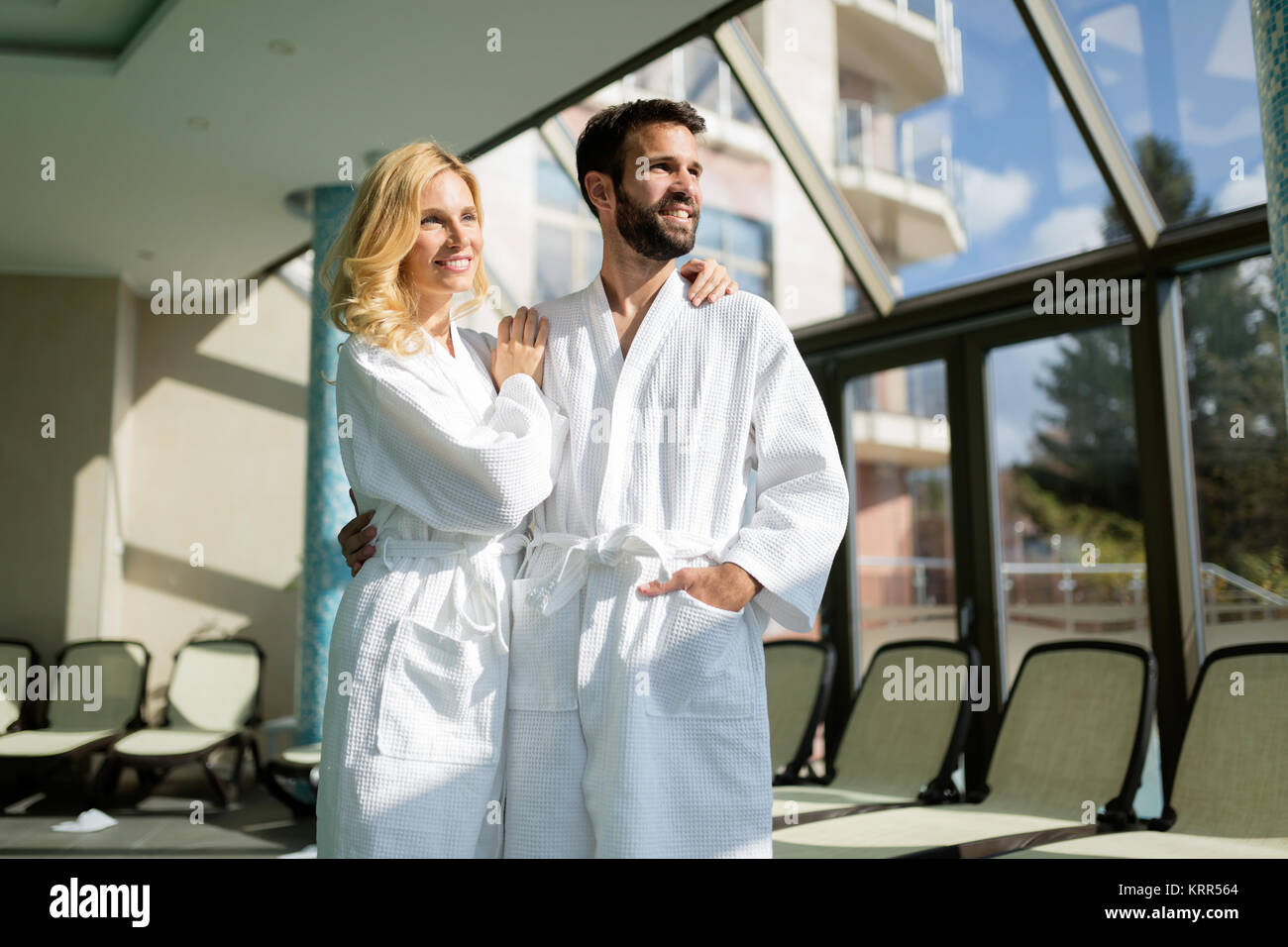 Beautiful cheerful couple relaxing in spa center Stock Photo