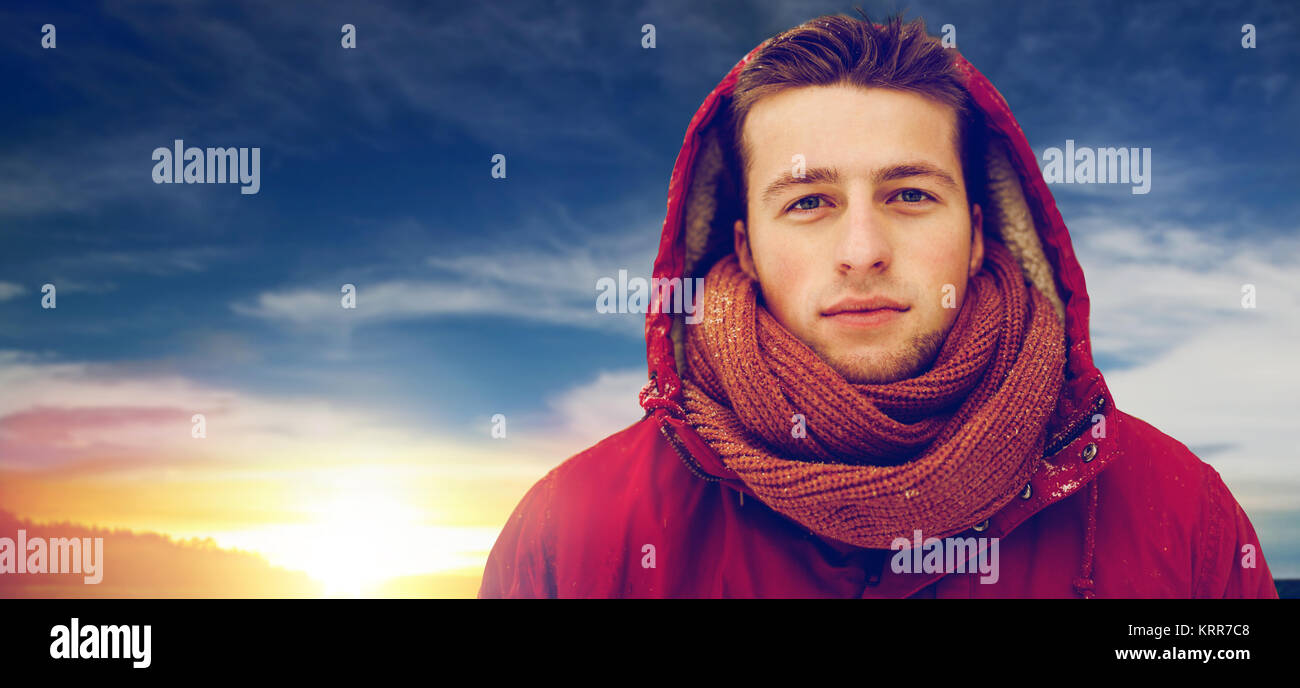 happy man in winter jacket with hood outdoors Stock Photo - Alamy