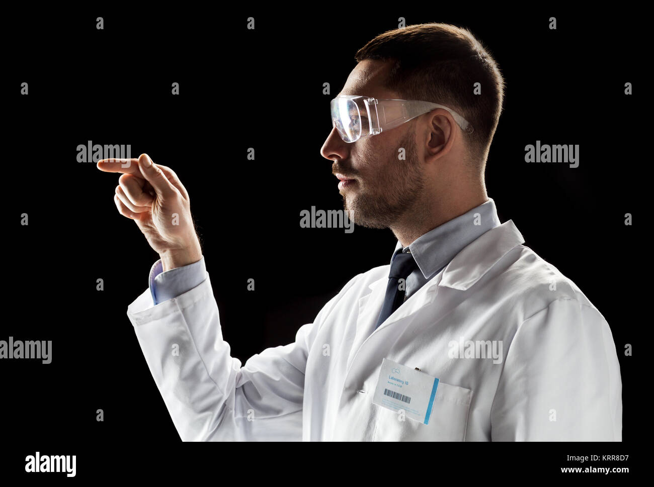 doctor or scientist in lab coat and safety glasses Stock Photo Alamy