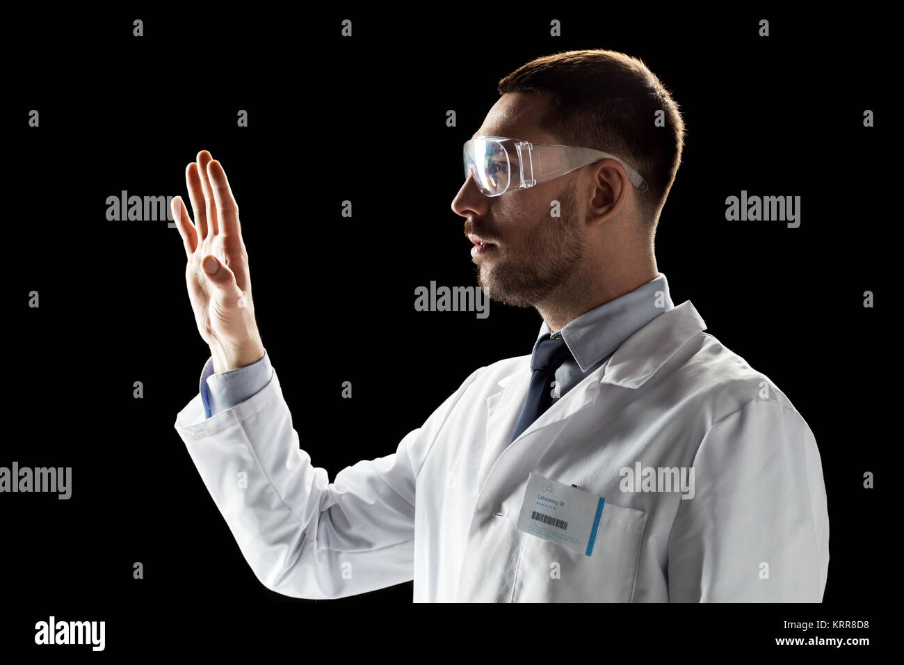 doctor or scientist in lab coat and safety glasses Stock Photo Alamy