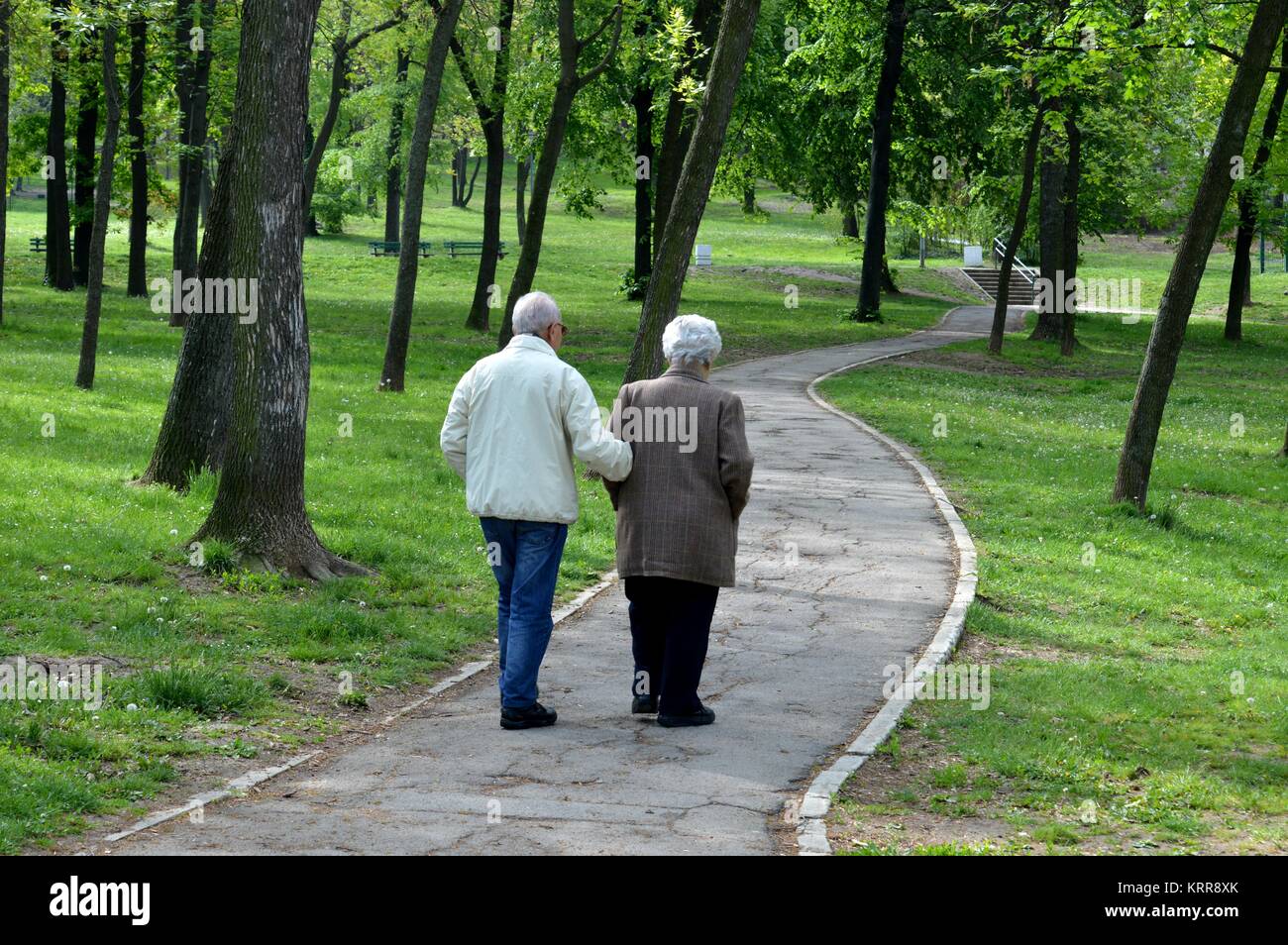 old couple walking in the park Stock Photo - Alamy