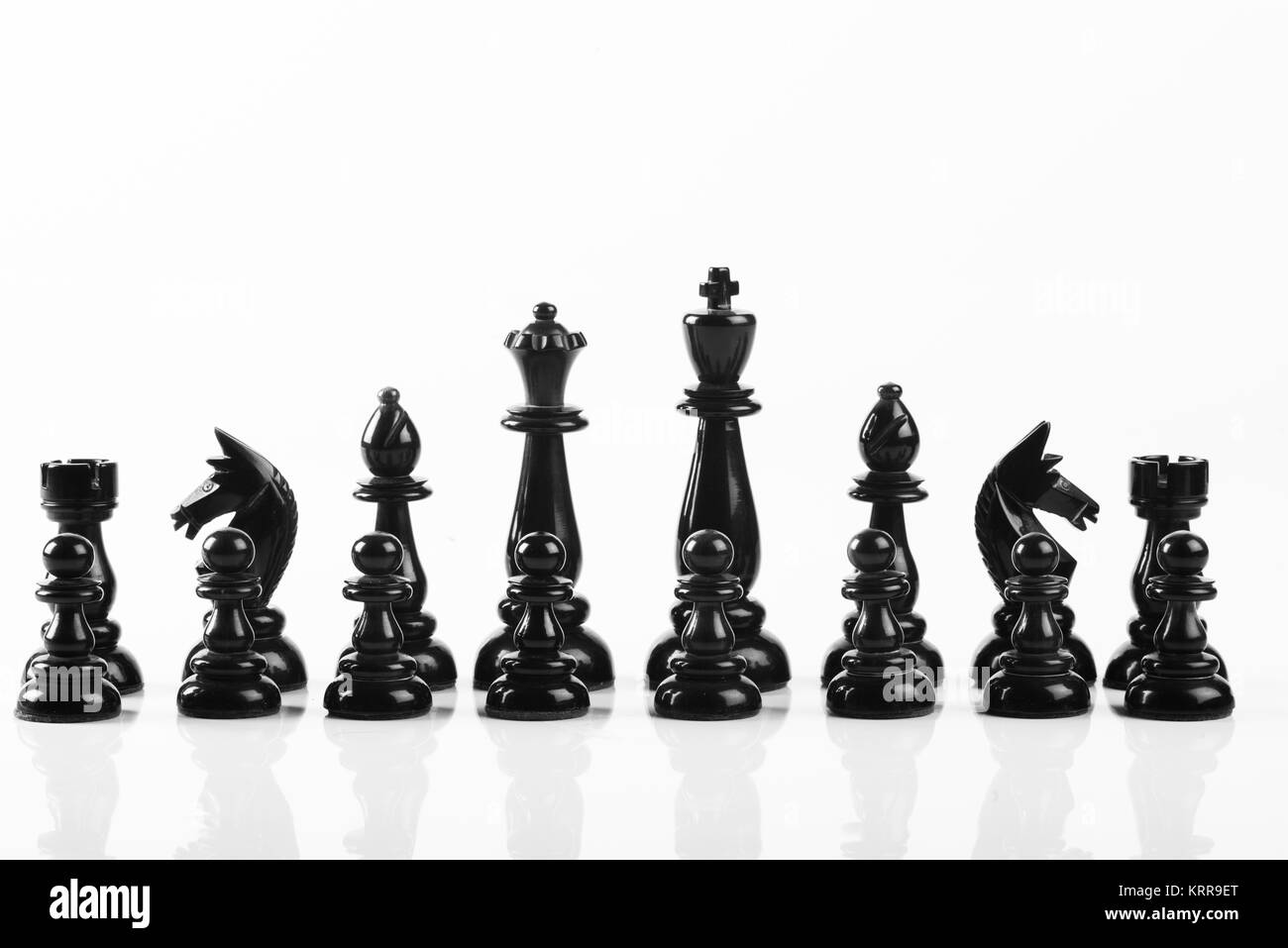 Chess black team over a white background Stock Photo