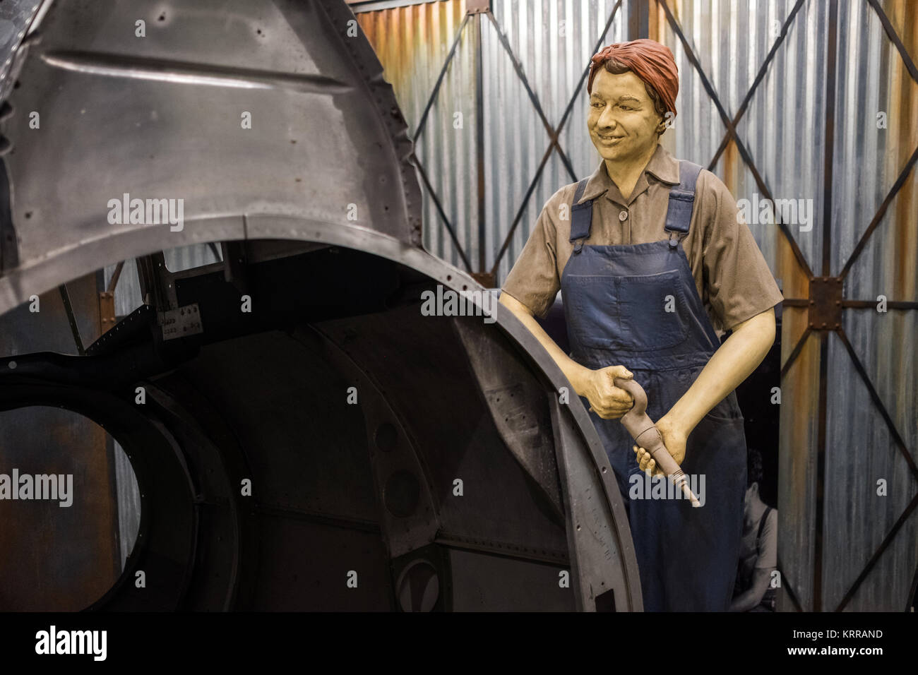 A life-size diorama depicting a Rosie the Riveter working during World War II as part of an exhibit on the Second World War at the Smithsonian National Museum of American History in Washington DC. Stock Photo