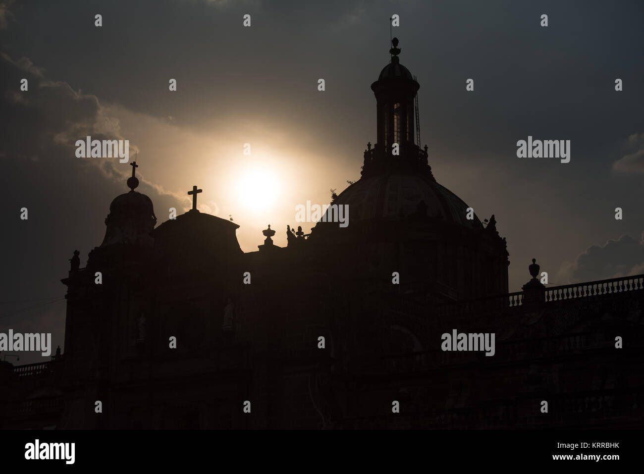 Silhouette of the rooftop of the Metropolitan Cathedral in Mexico City, outlined against the sun. Stock Photo