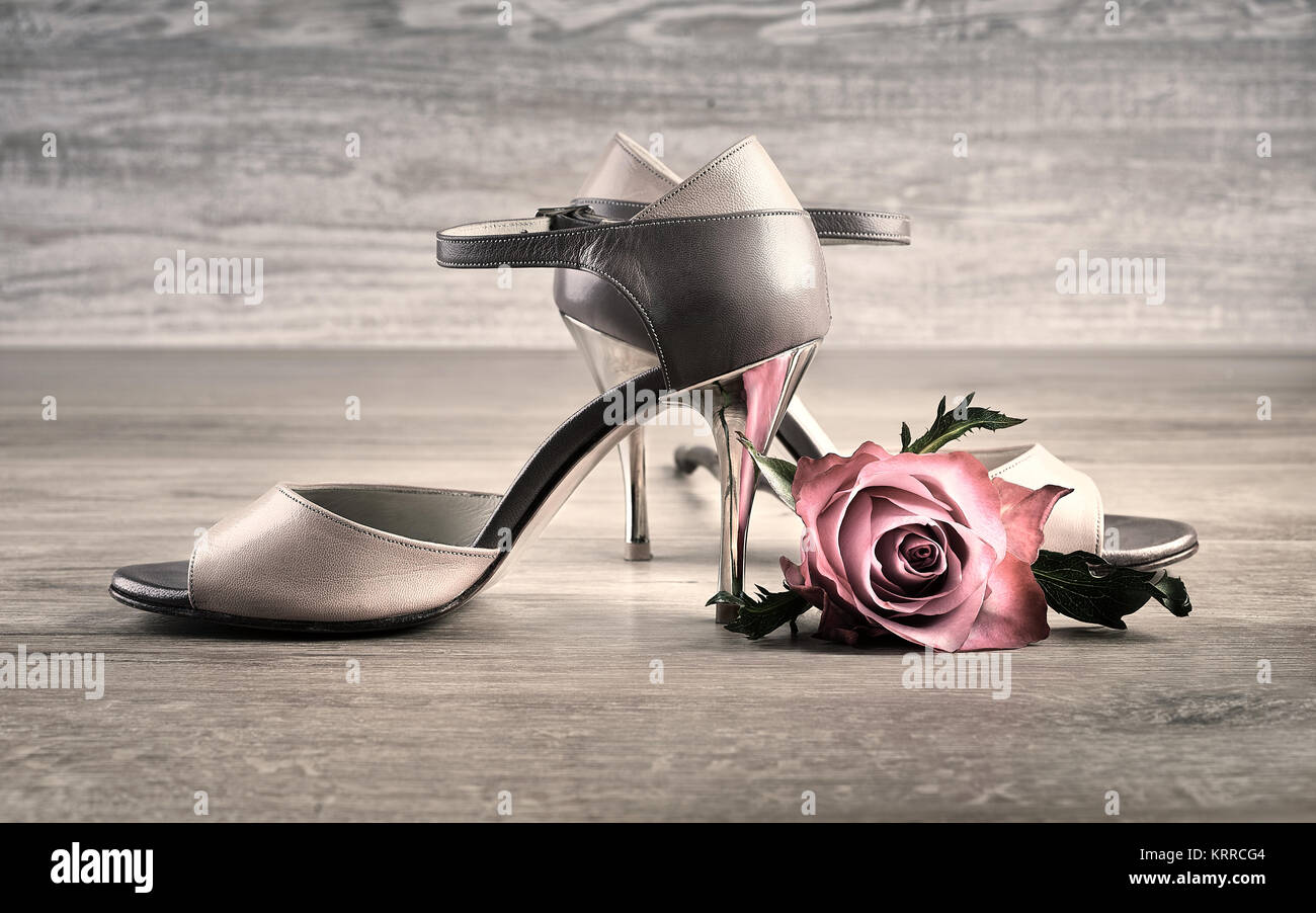 Argentine tango shoes with a rose on wooden floor Stock Photo - Alamy