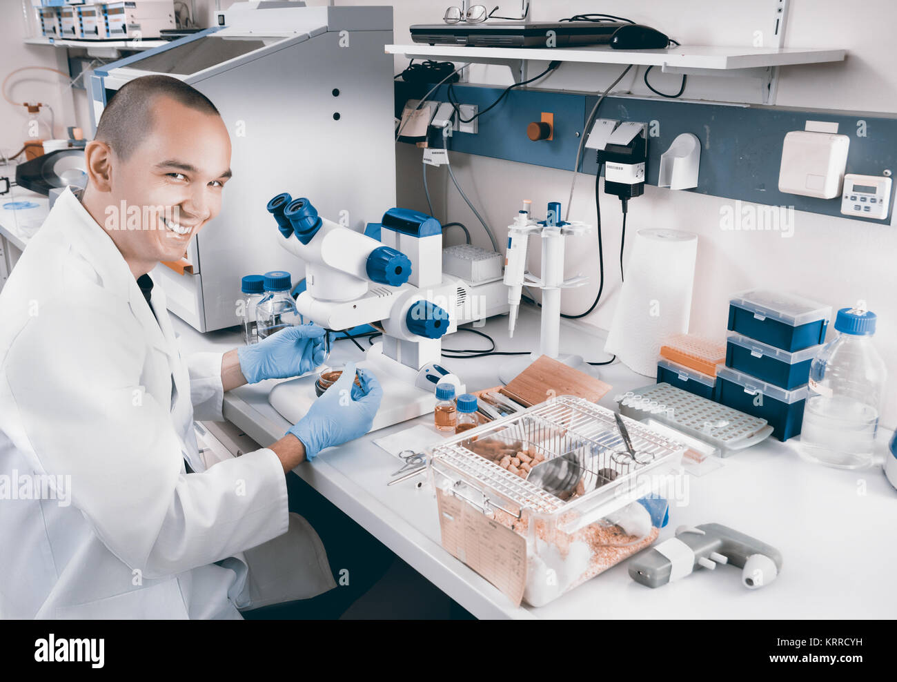 Smiling young scientist works in the lab Stock Photo