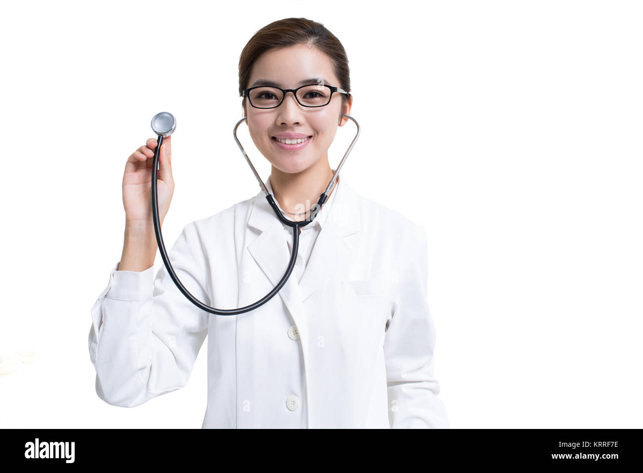 Young female doctor using stethoscope Stock Photo - Alamy