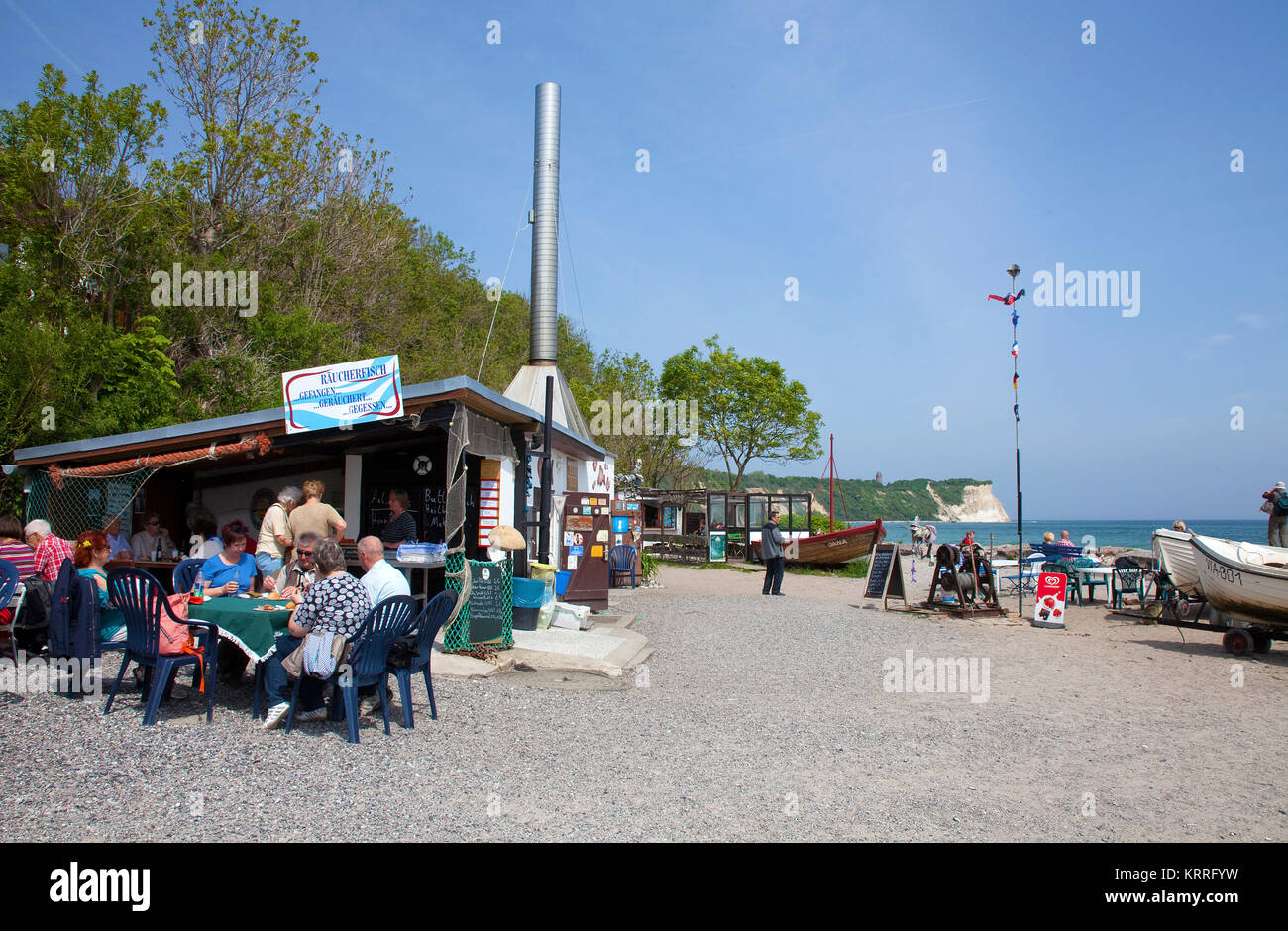People at the beach of the village Vitt, Fish snacks at fish smoke house, Cape Arkona, North cape, Ruegen island, Baltic Sea, Germany Stock Photo