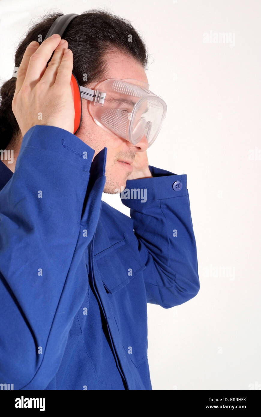 Arbeiter mit Gehoerschutz und Augenschutz - building worker with ear protection Stock Photo