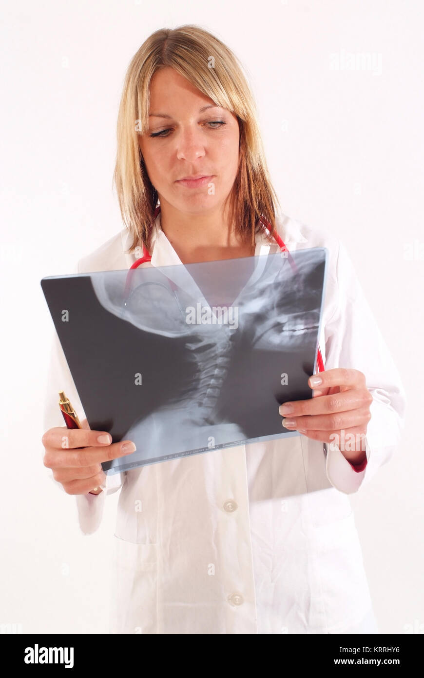 ƒrztin betrachtet Roentgenbild, Halswirbelroentgen - woman doctor with x-ray Stock Photo