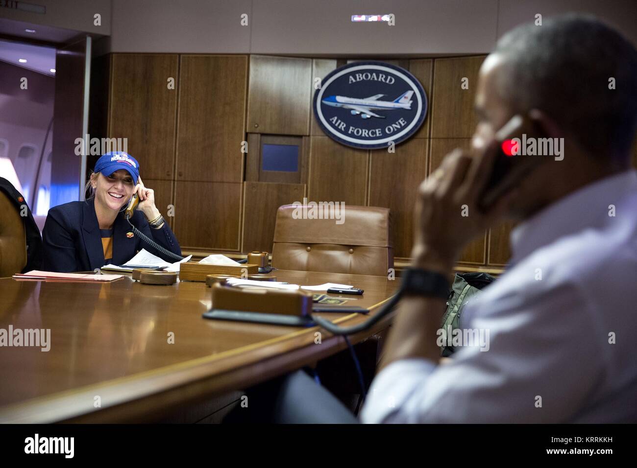 U.S. White House Deputy Chief of Staff Anita Decker listens on as U.S. President Barack Obama calls Chicago Cubs Manager Joe Maddon to congratulate him on the teams World Series win aboard Air Force One November 3, 2016. Stock Photo