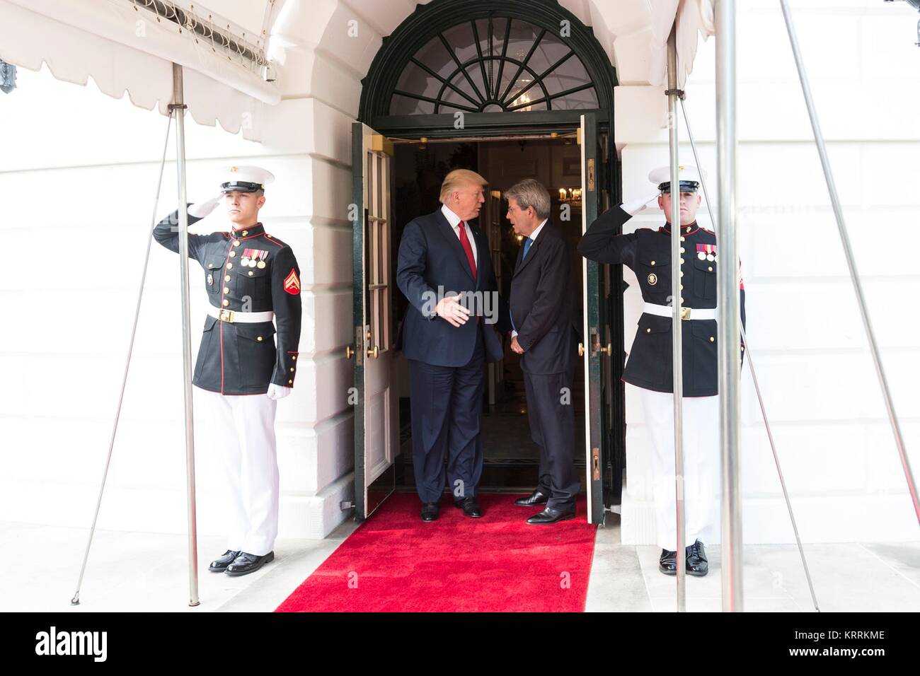 U.S. President Donald Trump (left) bids farewell to Italian Prime Minister Paolo Gentiloni at the White House South Portico entrance April 20, 2017 in Washington, DC. Stock Photo