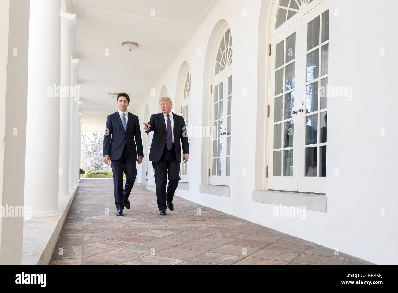 Canadian Prime Minister Justin Trudeau (left) and U.S. President Donald Trump walk along the White House Colonnade February 13, 2017 in Washington, DC. Stock Photo
