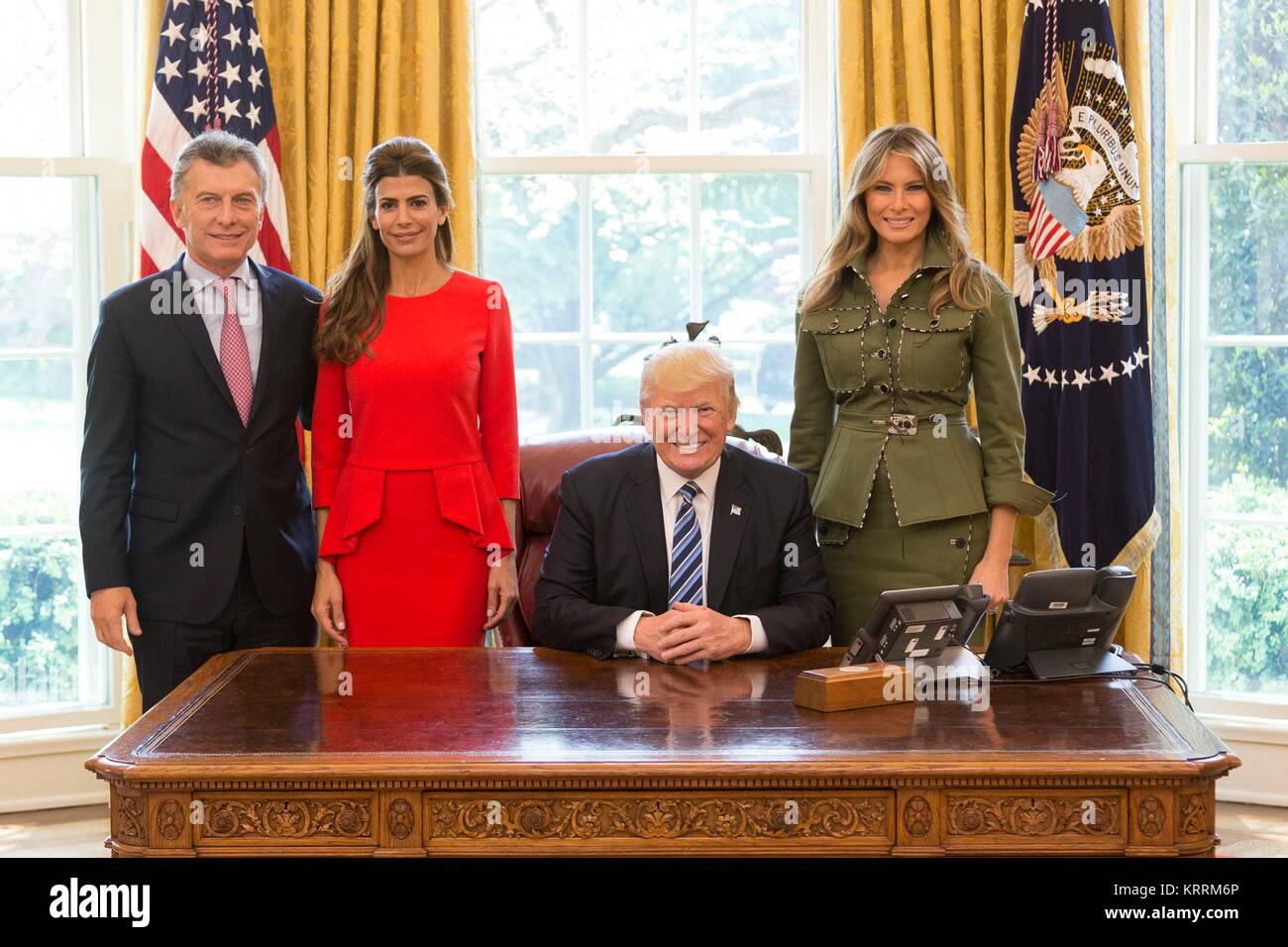 Argentinian President Mauricio Macri (left) and wife Juliana Awada pose with U.S. President Donald Trump and First Lady Melania Trump at the White House Oval Office April 27 2017 in Washington, DC. Stock Photo