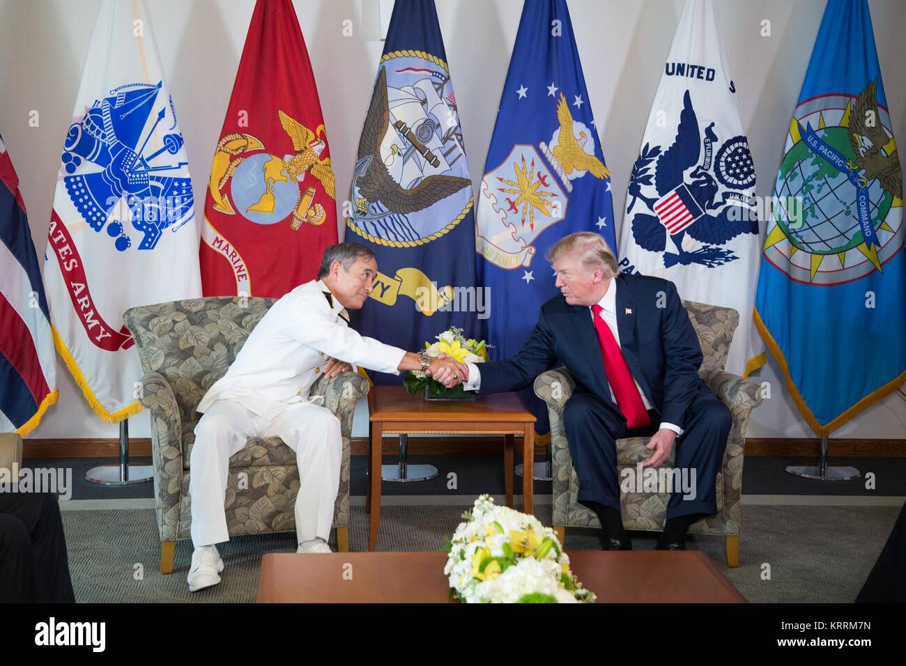 U.S. Pacific Command (PACOM) Commander Harry Harris (left) greets U.S. President Donald Trump upon his arrival at the U.S. Pacific Command Headquarters November 3, 2017 in Aiea, Hawaii. Stock Photo