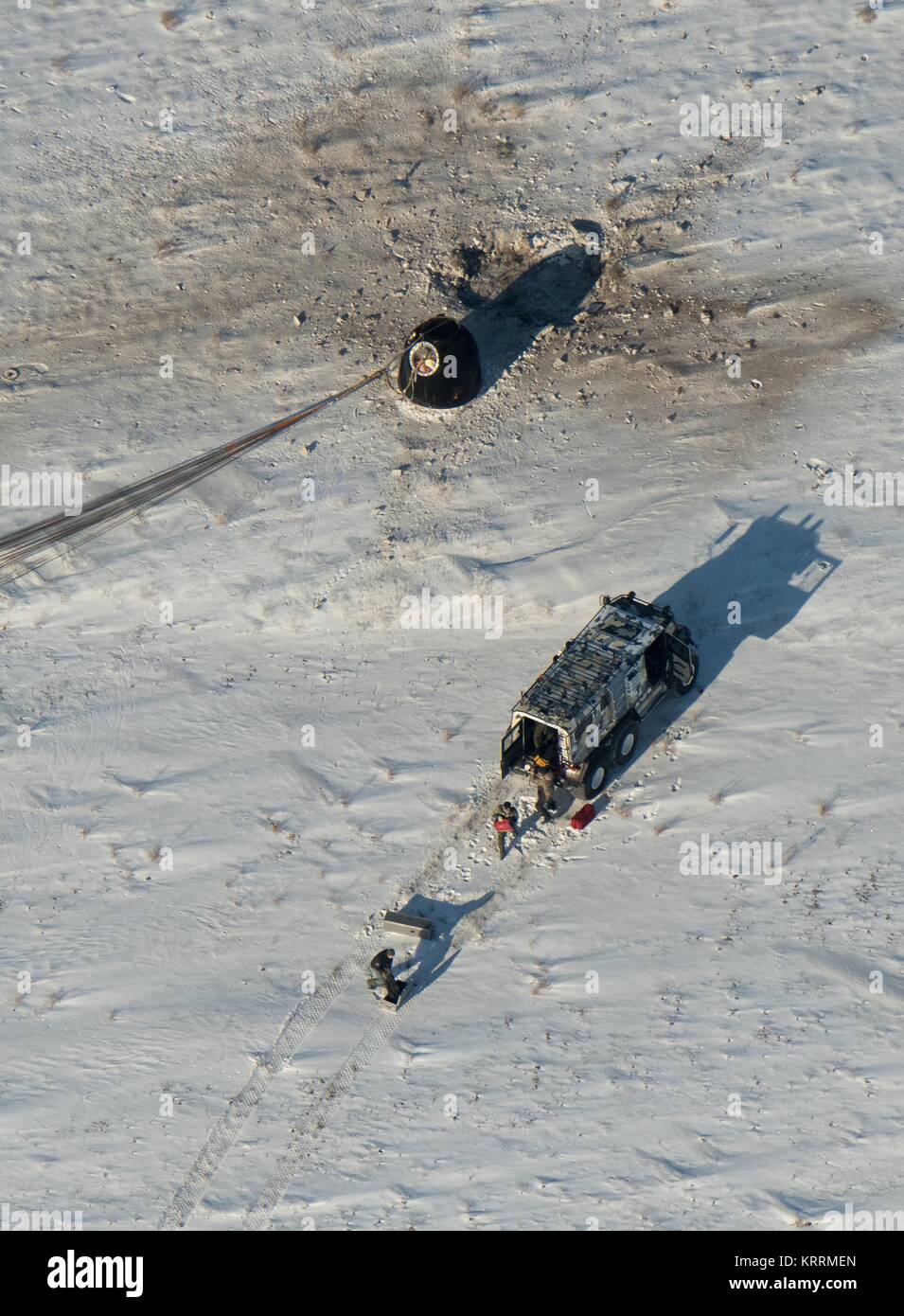 The NASA International Space Station Expedition 53 Soyu MS-05 spacecraft lands in the sand December 14, 2017 in Zhezkazgan, Kazakhstan. Stock Photo