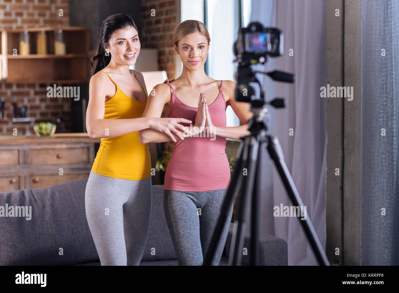 Pleasant cheerful women looking into the camera Stock Photo