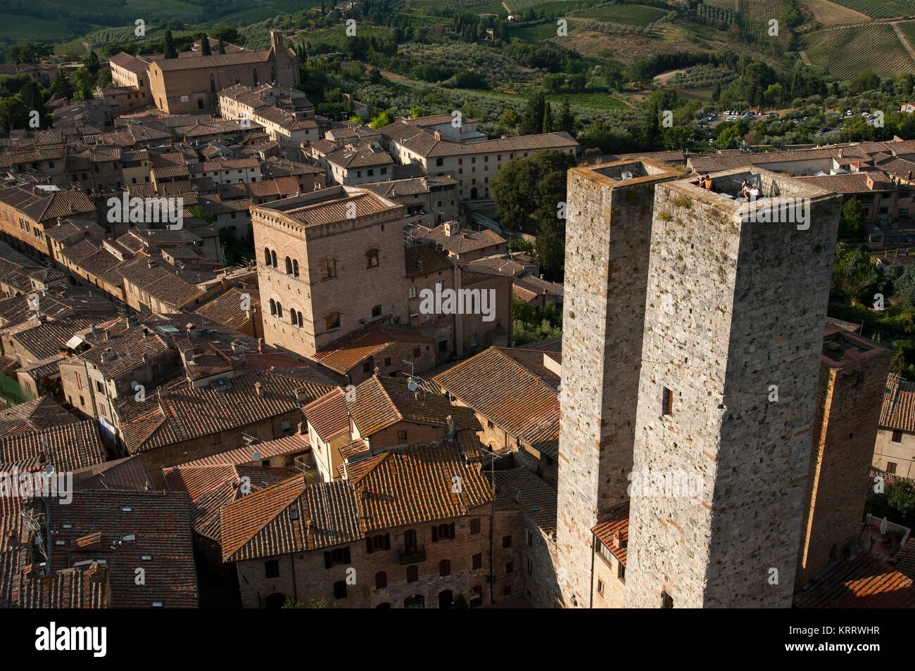 Medieval towers from XIII century, Torri dei Salvucci and Casa-Torre Pesciolini, and Romanesque and Italian Gothic Chiesa di Sant'Agostino (Church of  Stock Photo