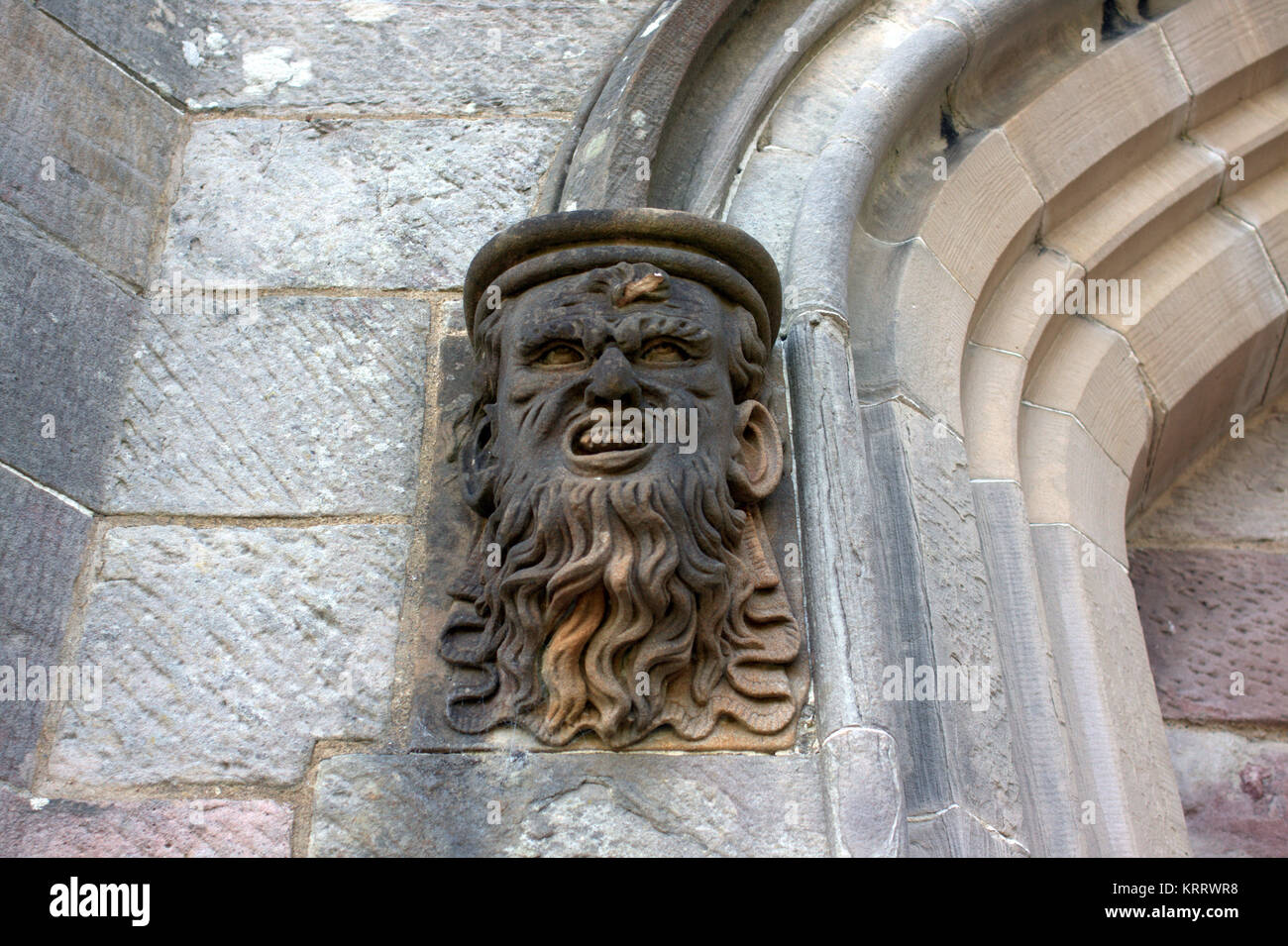 church gargoyles human face the green man cardross church door entrance Stock Photo