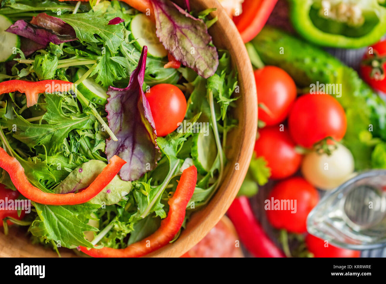 Fresh rustic vegetable salad on rustic background Stock Photo - Alamy